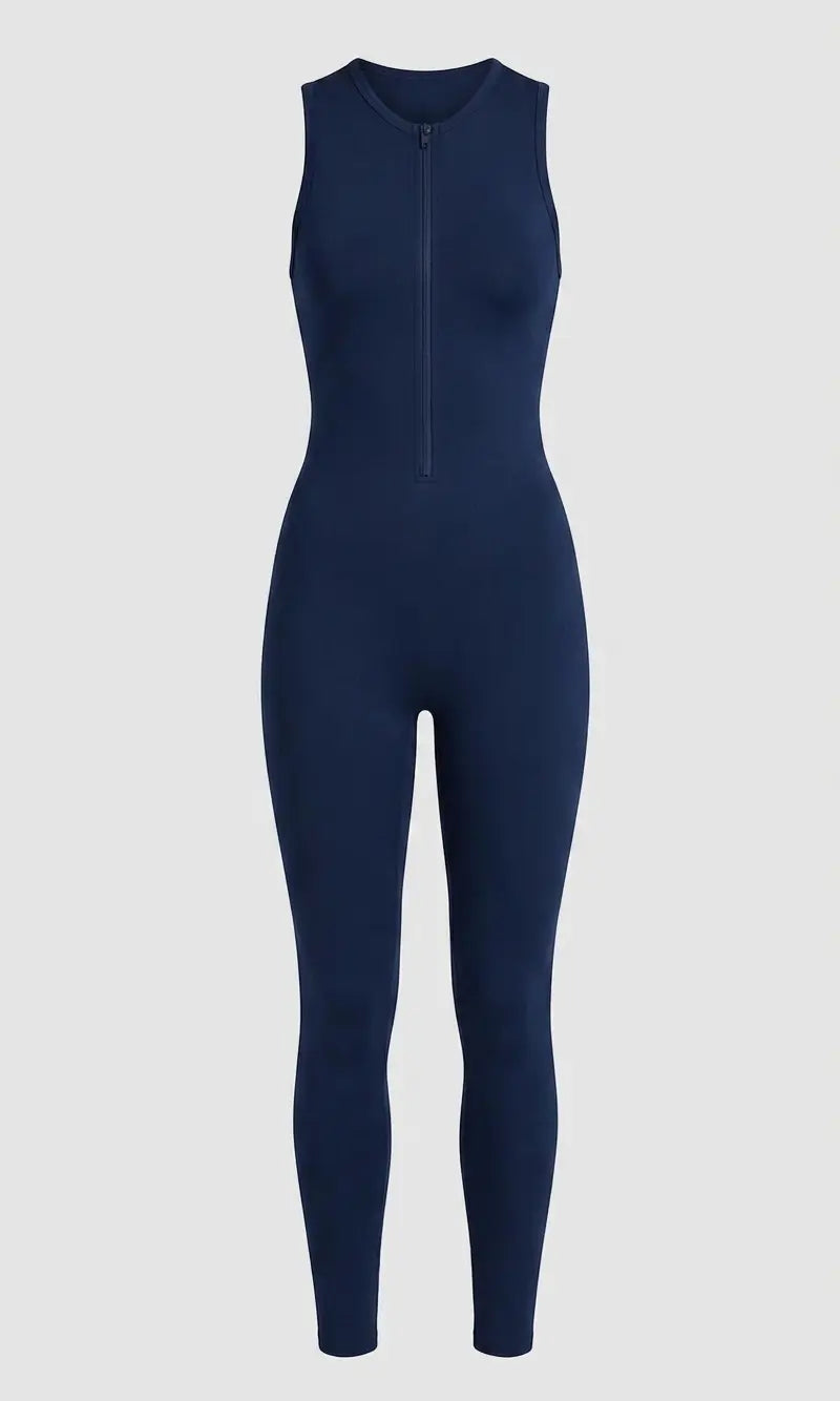 A sleeveless navy blue one-piece jumpsuit with a front zipper, shown on a light gray background.