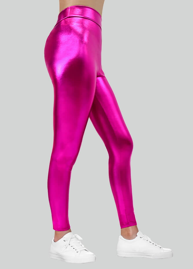 A pair of high-rise metallic pink leggings, paired with white sneakers.