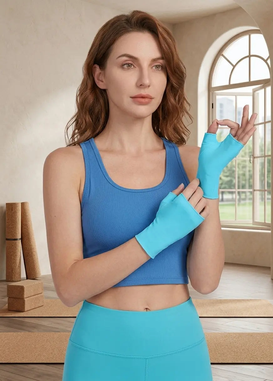 Woman wearing a blue athletic outfit with gloves indoors