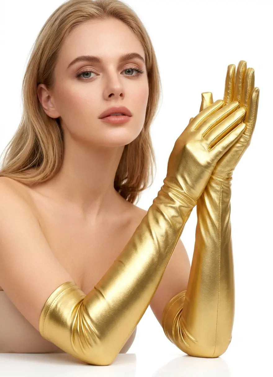 A woman wearing long, shiny metallic gold gloves that extend past the elbow, posed against a clean white background.
