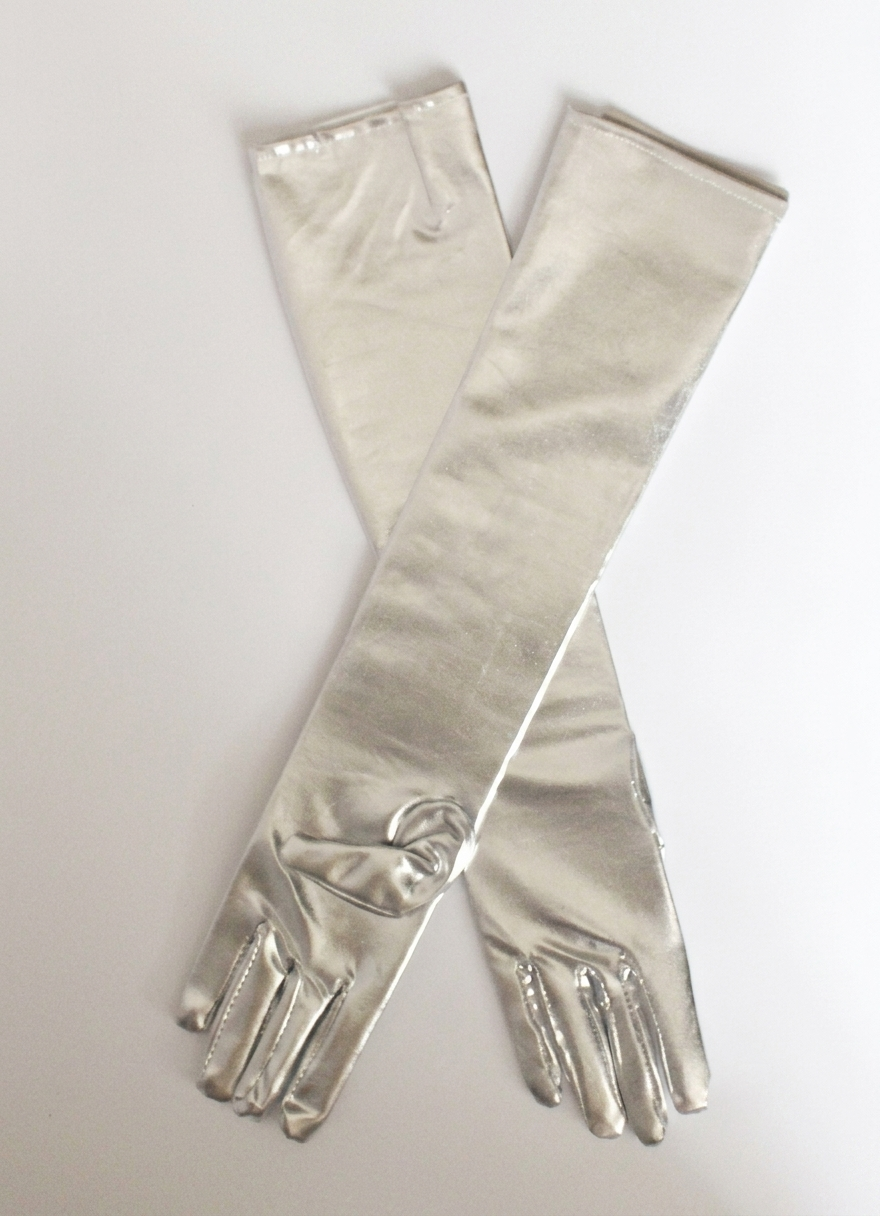 A pair of long, shiny metallic silver gloves laid flat in an X shape on a light gray background.
